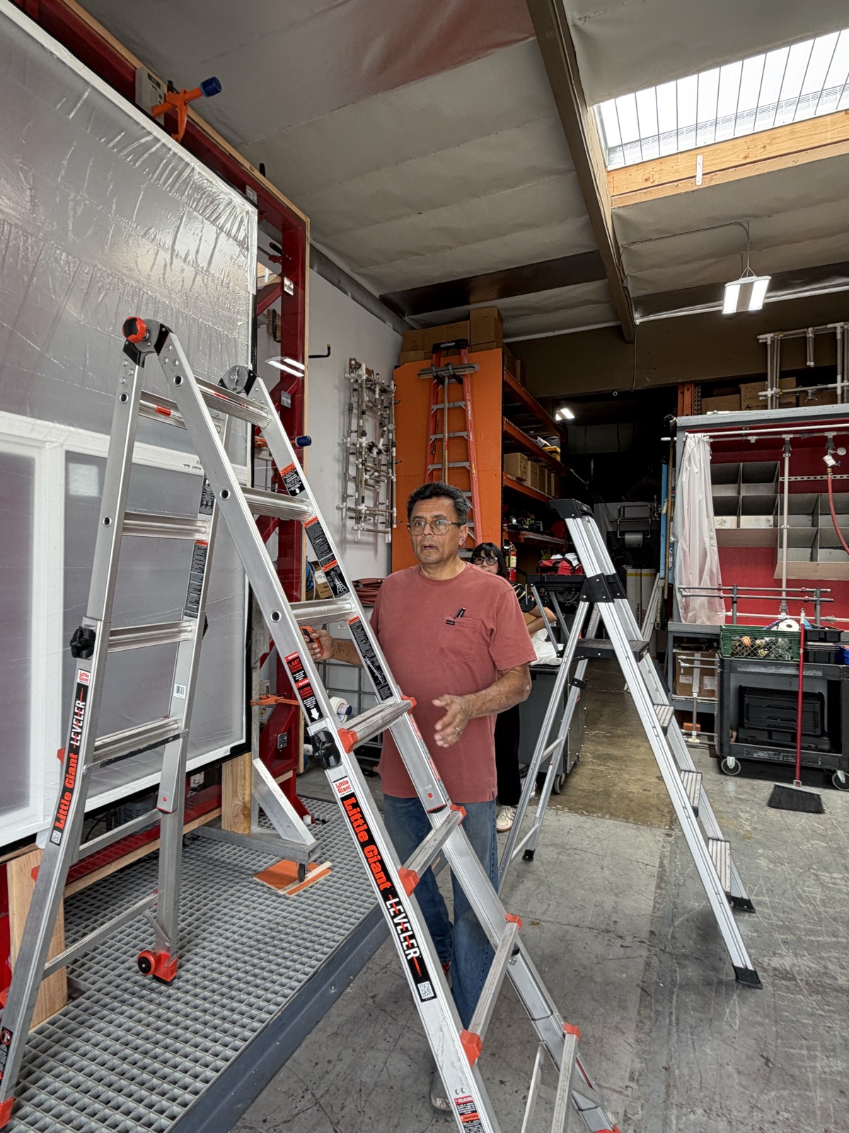 Jimmy Cruz beside a masked window specimen in the laboratory